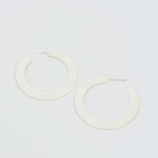 hoop silver earrings flat and wide shape yet light. Modern chic style for an urban look. Everyday jewelry