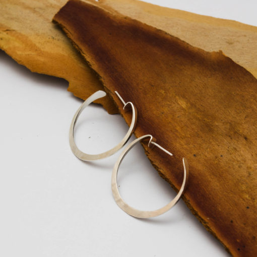 Hoop forged silver earrings, intricate flat shape. Light and comfortable. Modern chic style for an urban look. Everyday jewelry