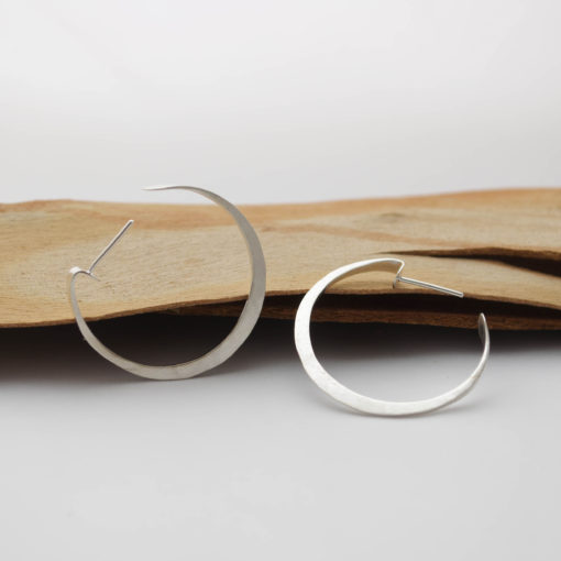 Hoop forged silver earrings, intricate flat shape. Light and comfortable. Modern chic style for an urban look. Everyday jewelry