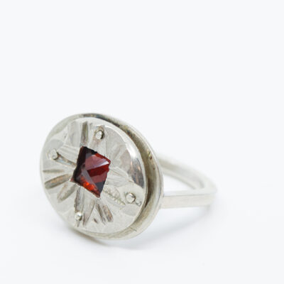 Garnet and textured silver top ring